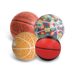 A selection of four basketballs in various colours, including orange, red, and patterned designs, featuring logos.