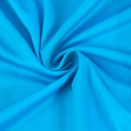 A close-up of a blue polyester fabric, showcasing a smooth texture with a spiral pattern. It has a subtle sheen.