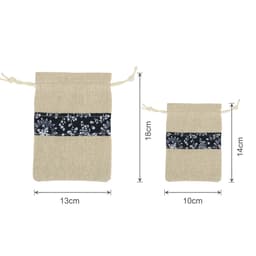 A set of cotton linen patchwork drawstring bags in beige and navy, featuring floral patterns and varying sizes.
