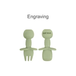 Two pieces of light green silicone cutlery for kids, featuring a fork and spoon design, with a branding logo.