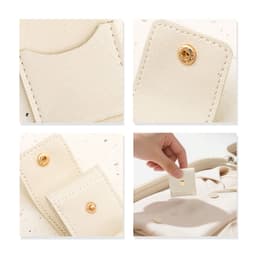 A mini synthetic leather jewellery bag in cream colour, featuring gold snap closures and interior compartments.