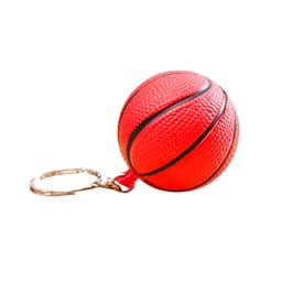 A red basketball stress item attached to a metal keyring, featuring a textured surface and black lines.