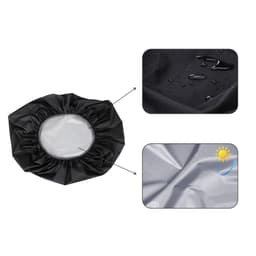 A black reflective backpack rain cover with a circular opening, featuring water droplets and a shiny surface.