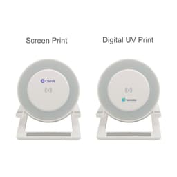 A wireless charger with a light feature in grey and white, featuring different printing options on the surface.