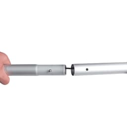 A hand connecting two sections of a silver metal pole for a display framework.