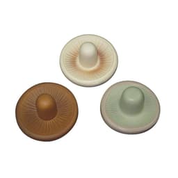 A set of three mushroom-shaped stress relievers in brown, cream, and green colours, featuring a ridged base and bulbous top.
