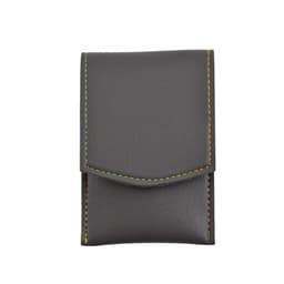 A portable manicure set in a grey synthetic leather case with contrast stitching. The case features a flap closure and a logo.