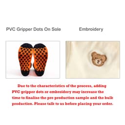 A pair of knee-high football socks featuring an orange towel bottom with black gripper dots and an embroidered design.