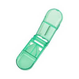 A green pill box with a cutter feature, designed for medication storage and organisation.