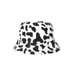 A cow print bucket hat featuring a white background with black spots. The hat has a wide brim and a simple design.