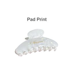 A transparent acetate hair clip in white with a glossy finish and an elegant design. Features a logo on the side.