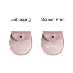 A pink oval velvet jewelry pouch with a button closure and branding options for debossing and screen printing.