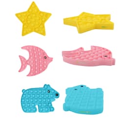 Various fidget toys in bright colours including a yellow star, pink fish, blue bear, and green whale shapes.