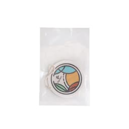An expandable dishwashing sponge in a clear package, featuring a colourful circular design with green, blue, and orange elements.