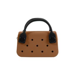 A brown mini handbag with black handles, featuring several decorative holes in the front.