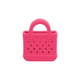 A small pink bag charm with holes and handles, made from EVA material. It features a textured surface and a branding logo.