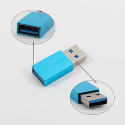 A USB data blocker in blue with a metallic finish, featuring a standard USB connector on each end.