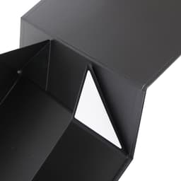 A medium foldable magnetic box in black with a white interior triangle. Features a logo on the exterior.