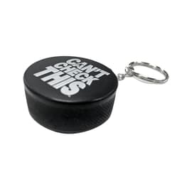 A black keyring shaped like a hockey puck with a silver keychain and decorative text on the surface.
