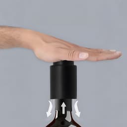 A drink bottle with a black push-type wine stopper, featuring an integrated scale on top.