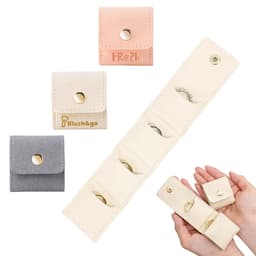 Mini synthetic leather jewellery bag available in pink, beige, and grey, featuring multiple compartments and a secure snap closure.