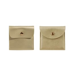 A square gold PU leather jewelry pouch with a snap closure and smooth finish, featuring two views of the product.