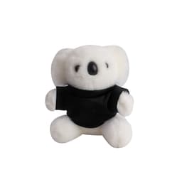 A cute white koala plush toy wearing a black shirt, featuring a friendly expression and soft texture.