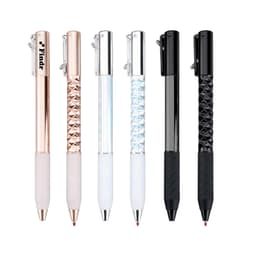 A set of four pens featuring rose gold, iridescent, black, and white designs, each with a unique textured grip.