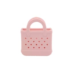 A pink mini EVA bag charm with perforated design and a handle, featuring a small opening at the top.