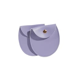 A purple oval PU leather jewelry pouch with a rounded flap and a metal snap. It features a smooth exterior.