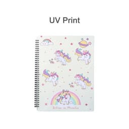 A spiral-bound folder featuring colourful unicorn illustrations on a light background, with stars and clouds. It has a logo.