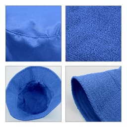 A blue dual-material reversible bucket hat with textured and smooth fabric sections, featuring a logo.