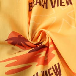 A yellow fabric featuring palm tree and beach-themed designs in red and brown tones. It has a logo present.