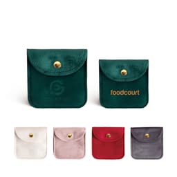 A square velvet jewellery pouch available in green, white, pink, red, and grey, featuring a logo.