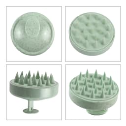 A green hair scalp massager with textured surfaces for gentle stimulation. Features a circular design and a sturdy handle.