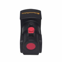A black locomotive-shaped stress reliever with a red button and circular detail, featuring a logo on top.