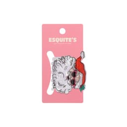 A hair claw featuring a festive design with a Santa hat and sunglasses, displayed on a pink card with a logo.