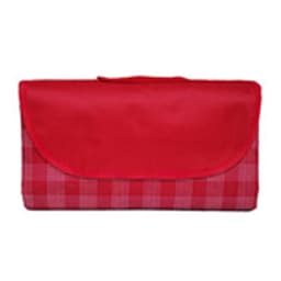 A red and pink checkered picnic blanket folded and secured with a flap, featuring a logo on the exterior.