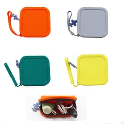 Four silicone travel bags displayed in orange, grey, green, and yellow, with one bag open showing cables inside.