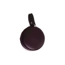 A round, dark brown PU mini tape measure with a keyring attachment.