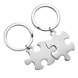 Stainless steel keychains in the shape of interlocking puzzle pieces, featuring a shiny metallic finish.