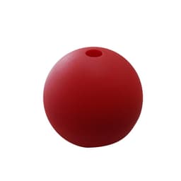 A red silicone ice ball mold with a small opening on top, designed for making ice spheres.