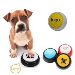 A brown puppy next to colourful recordable voice buttons in black, yellow, red, and blue, with a logo on one button.