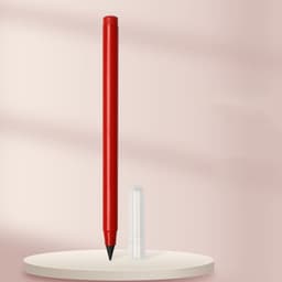 A red pencil stands vertically next to a clear cap on a minimalist display surface.