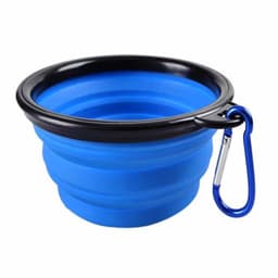 A blue collapsible bowl with a black rim and a carabiner attached for easy carrying.