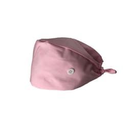 A pink medical work cap featuring a button and an adjustable tie at the back.