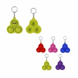 Decompression toys with key rings in bright colours: green, pink, red, purple, and blue. Each features a logo.