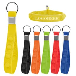 A collection of colourful silicone keychain wristbands in yellow, black, red, orange, green, and blue, each with a logo.