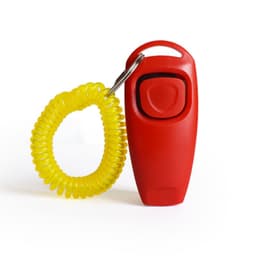 A red pet training clicker with a yellow spiral wrist strap.