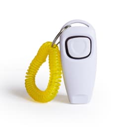 A white pet training clicker with a black button, attached to a yellow coiled keyring.